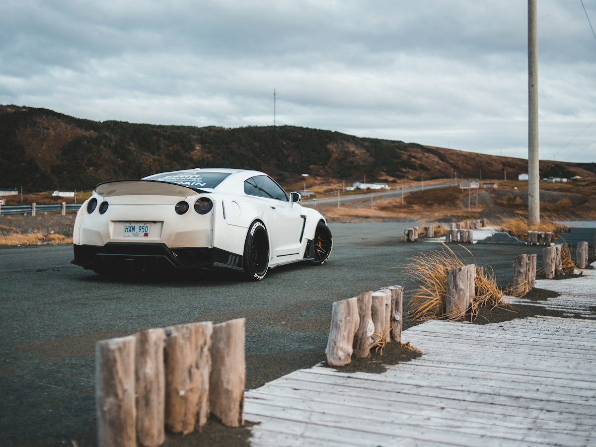 White sports coupe on a road
