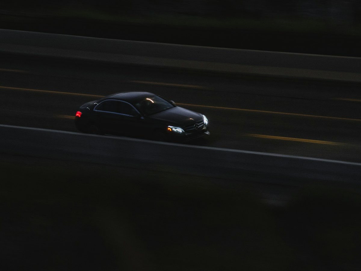 Sports car driving on a road